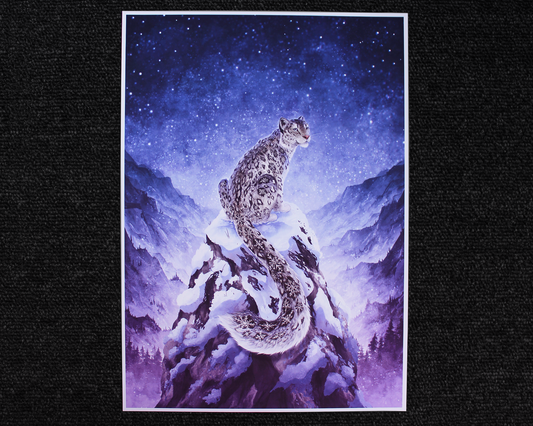 A4 Print of a snow leopard sat on the peak of a mountain. The snow leopard has snowflakes for the spot patterns, and in the background is a mountain range with a blue starry night sky.