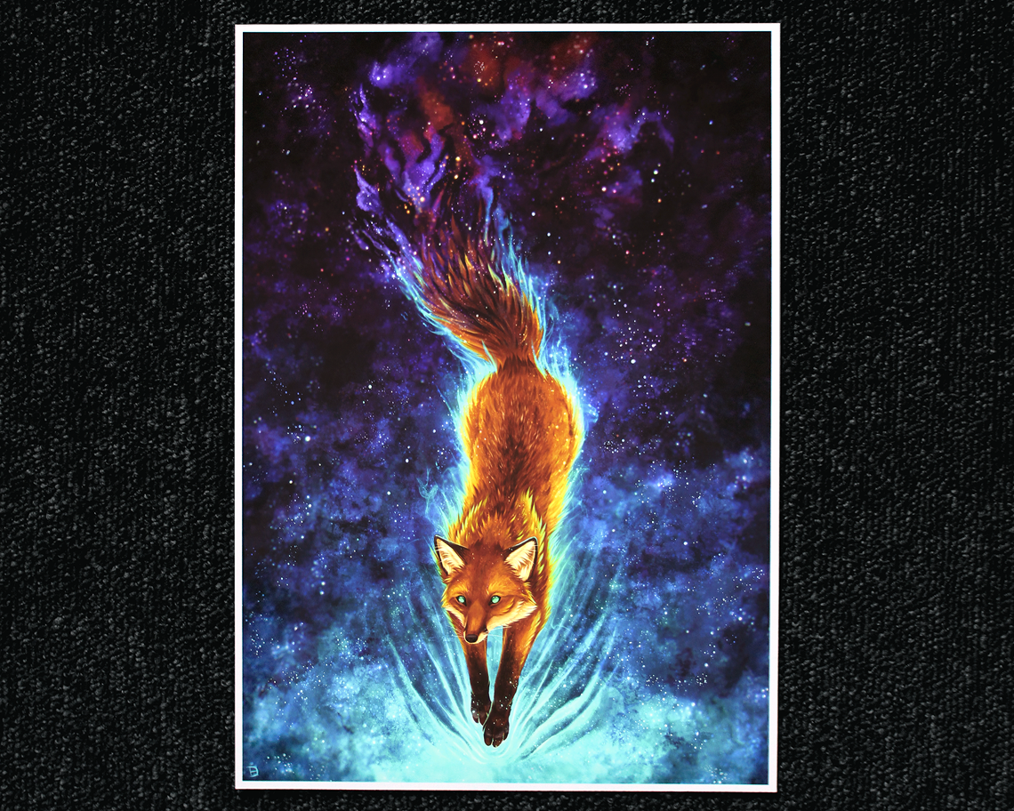 A4 print of a celestial fox, gliding through space. Their tail fades off in the space background, much like a nebula.