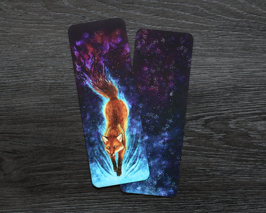 Bookmark of a celestial fox, gliding through space. Their tail fades off in the space background, much like a nebula.